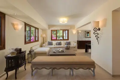 a living room with a couch and a table at Una Villa Rhodes in Ixia
