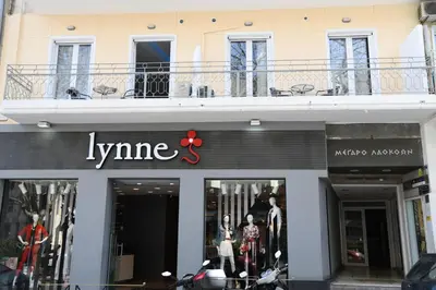 a store with a sign on the front of a building at City Heart Luxury Studio Aurora in Rhodes Town