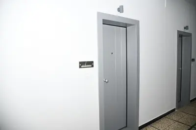 two elevator doors in a room with white walls at City Heart Luxury Studio Aurora in Rhodes Town