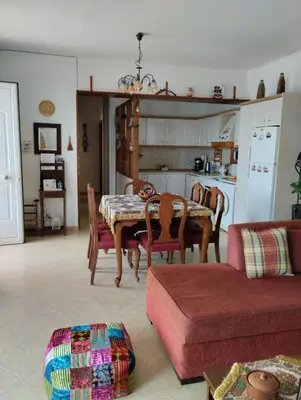 a kitchen and dining room with a table and chairs at Mata's Sea House in Lachania