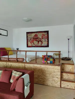 a living room with a couch and a bed at Mata's Sea House in Lachania