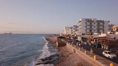 a view of a beach with buildings and the ocean at Sunrise Luxury Apartments Rhodes in Rhodes Town