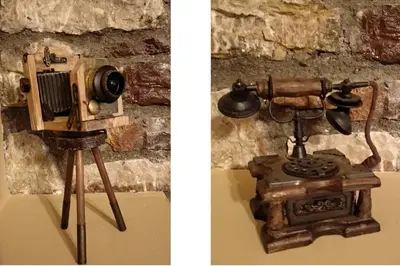 an old fashioned camera on a tripod next to a brick wall at Rustic House in Émbonas