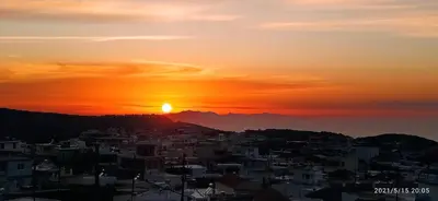 a view of a city at sunset at Rustic House in Émbonas