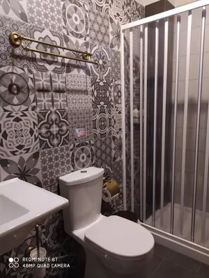 a bathroom with a toilet and a sink at Rustic House in Émbonas
