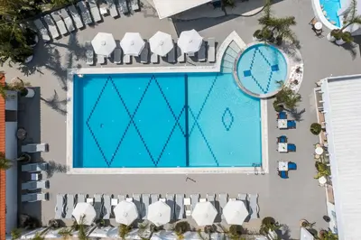 an overhead view of a swimming pool at a resort at Tinas Plus Hotel in Faliraki