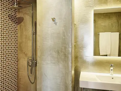 a bathroom with a shower and a sink at Kalithea Hills Appartment 1 in Koskinou