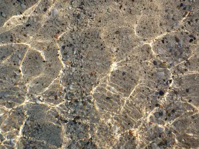 a close up of the sand with rocks at Bright Sun Villas in Halki