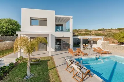 a villa with a swimming pool and a house at Villa Sea La Vie in Kiotari