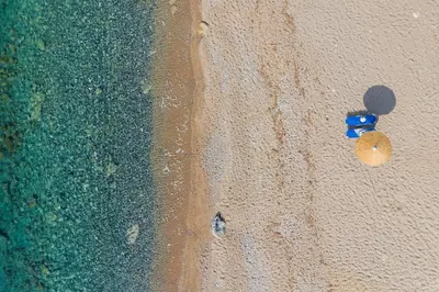 an overhead view of a beach with two beach balls at Villa Sea La Vie in Kiotari