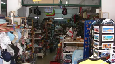 a store filled with lots of toys and other items at Apostolis studios Pefki Lindos Rhodes in Pefki Rhodes