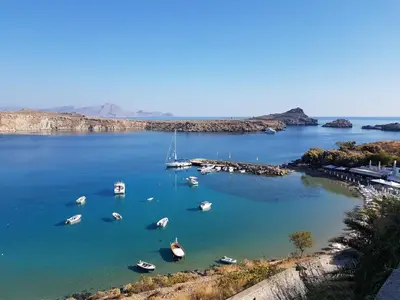 a group of boats in a large body of water at Villa Koki Studios in Líndos