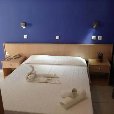 a bedroom with two towels on a bed at Zefyros Hotel in Rhodes Town