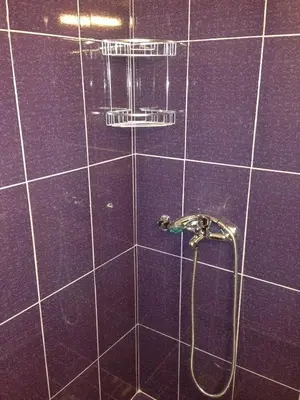 a purple tiled shower with a shower head at Zefyros Hotel in Rhodes Town