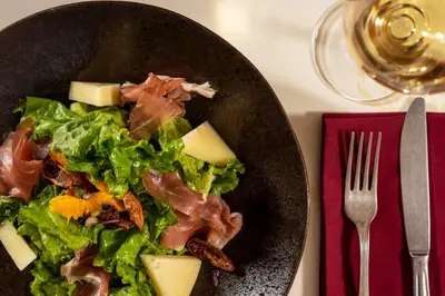 a plate of food with a salad and cheese at 10GR Boutique Hotel & Wine Bar in Rhodes Town