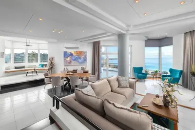 a living room with a couch and a table at Monte Smith Luxury Villas in Rhodes Town