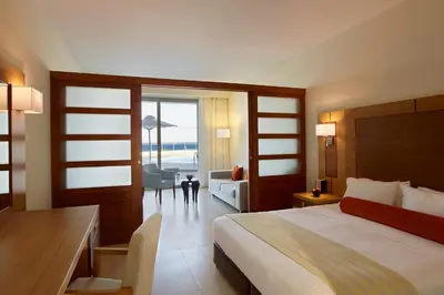 a hotel room with a bed and a desk and a room at Apollo Blue in Faliraki