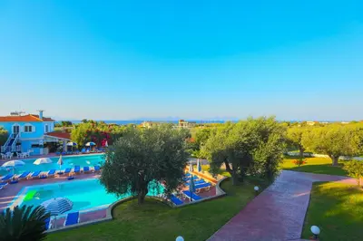 an overhead view of a pool at a resort at Filoxenia Apartments & Studios in Theologos