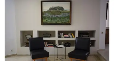 a waiting room with two chairs and a table at Majestic Hotel - Adults Only in Rhodes Town
