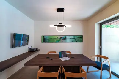 a dining room with a wooden table and chairs at Mariette Rhodes Urban Suites in Rhodes Town