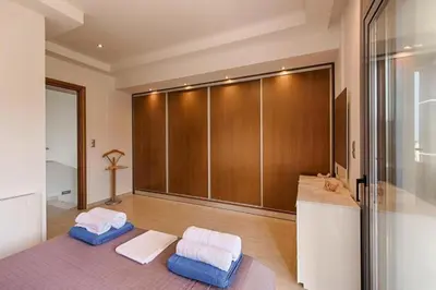 a room with two pillows and a closet at Villa Pandesia in Kremasti