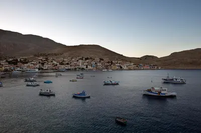 a group of boats in a large body of water at Villa Kalypso in Halki