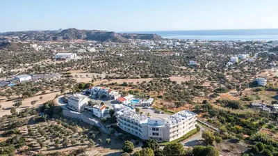 an aerial view of a large white building at Hillside Studios & Apartments in Faliraki