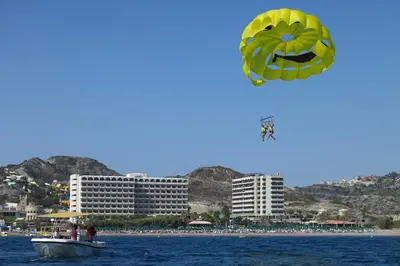 a large kite flying in the sky over a beach at Esperos Mare Resort & Spa in Faliraki