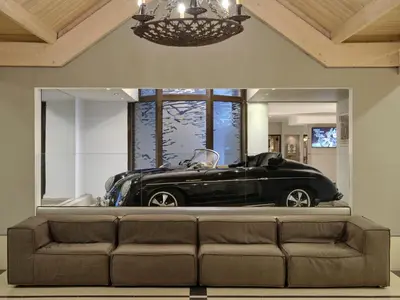 a black car is in a room with a couch at Esperos Mare Resort & Spa in Faliraki