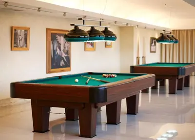 two pool tables in a room with billards at Esperos Mare Resort & Spa in Faliraki