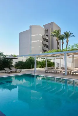 a swimming pool in front of a building at Epsilon Hotel Apartments in Faliraki