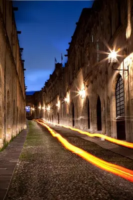 a city street at night with a long exposure at Camelot Traditional & Classic Hotel in Rhodes Town