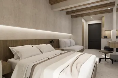 a bedroom with a large white bed and a desk at Sam's Faliraki in Faliraki