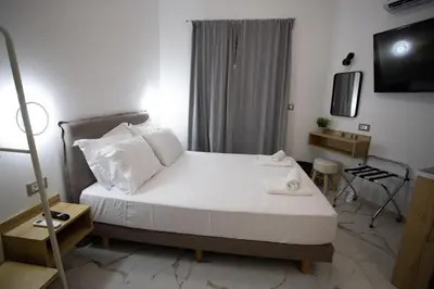 a bedroom with a large white bed in a room at Star Hotel in Rhodes Town