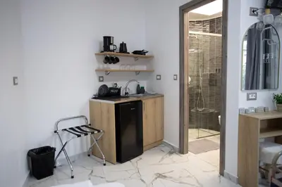 a kitchen with a sink and a shower in a room at Star Hotel in Rhodes Town