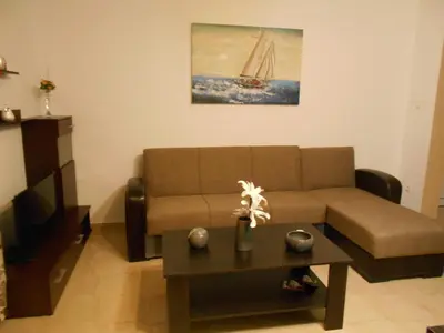 a living room with a couch and a coffee table at Village House in Kalithies