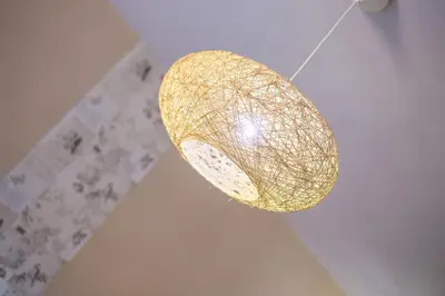 a gold chandelier is hanging from a ceiling at Yianna Studios in Faliraki