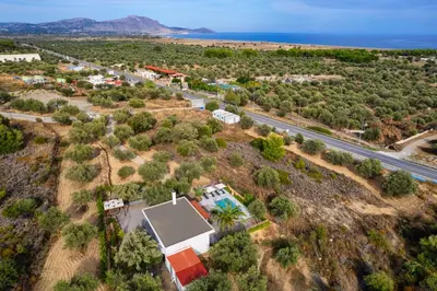 an aerial view of a house with a road at Evgenias Olive House in Kalathos