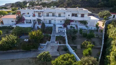 an aerial view of a large white house at Corafili Holiday Suites in Kiotari