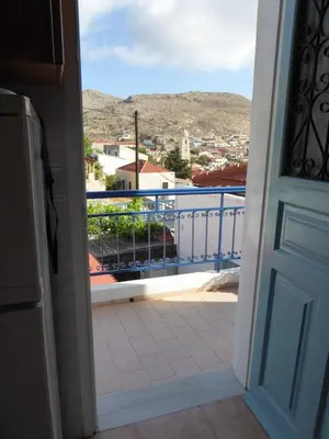 an open door to a balcony with a view at Villa Yorgos in Halki
