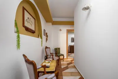 a dining room with a table and chairs at The Old Symi in Symi