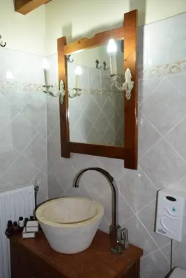 a bathroom with a sink and a mirror at Petrino in Rhodes Town