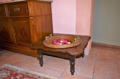 a wooden table with a bowl on top of it at Petrino in Rhodes Town