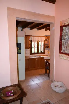 a large kitchen with a table and a counter top at Petrino in Rhodes Town