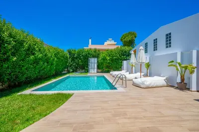 a swimming pool in the backyard of a house at Mediterranean Luxury Villa in Ialyssos
