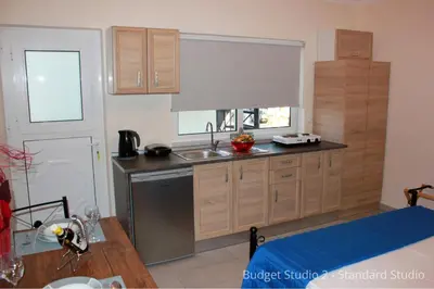 a kitchen with a sink and a counter top at Budget Studios Haraki in Haraki