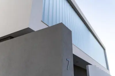a building with the number on the side of it at Momentum Villas in Ialyssos