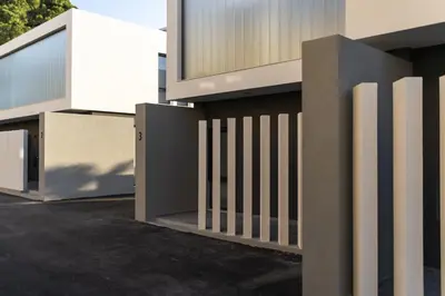 a fence on the side of a building at Momentum Villas in Ialyssos