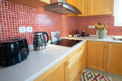 a kitchen with a counter with a coffee maker on it at Alkion Villa in Gennadi