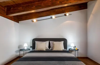 a bedroom with a bed and two night stands at La Luna Villa in Rhodes Town